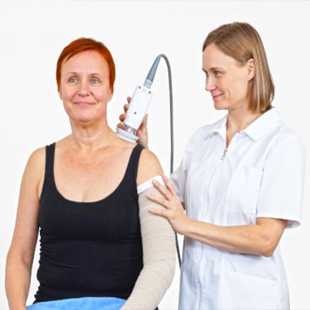 Woman receiving a medical procedure with the PhysioTouch on her back