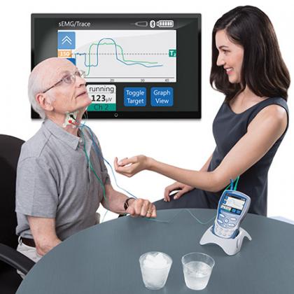 Man using the VitalStim with a woman therapist