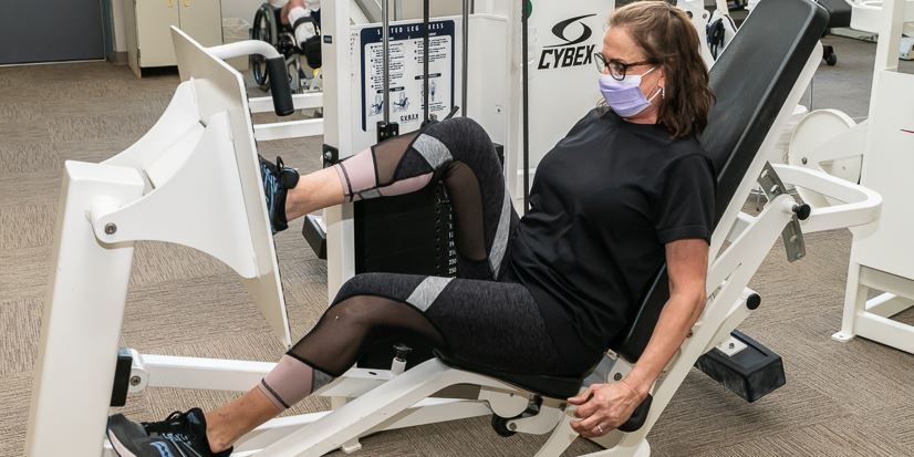 Patient exercising on leg press