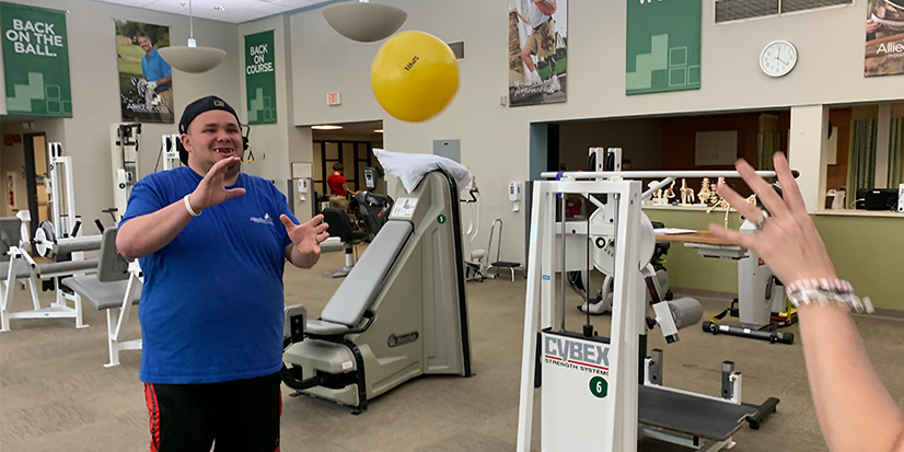 Victor working on balance and coordination in physical therapy